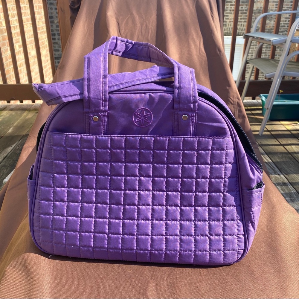 Purple yoga gym bag with bottom mat holder.